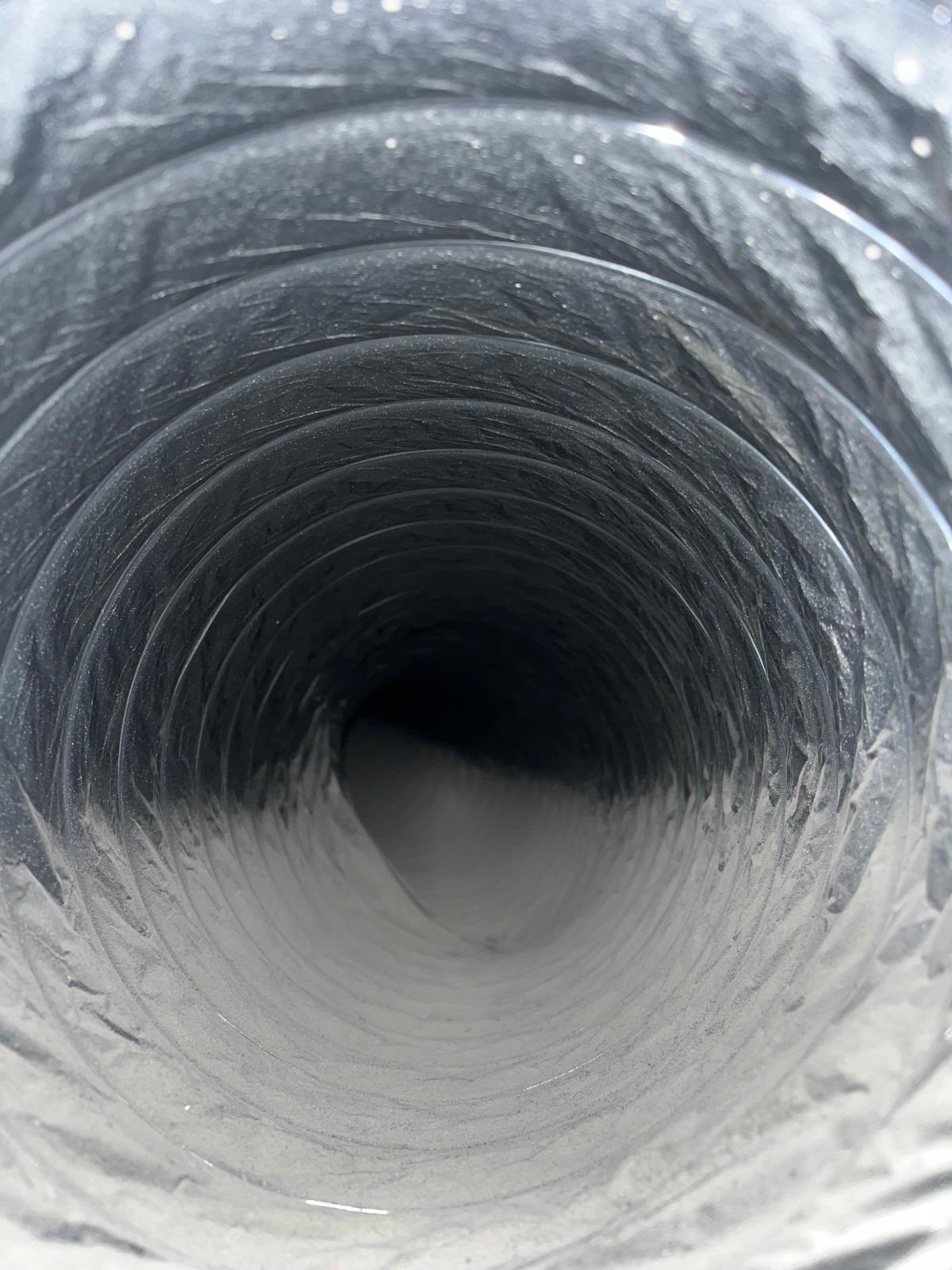 Dirty flexible air duct before professional air duct cleaning